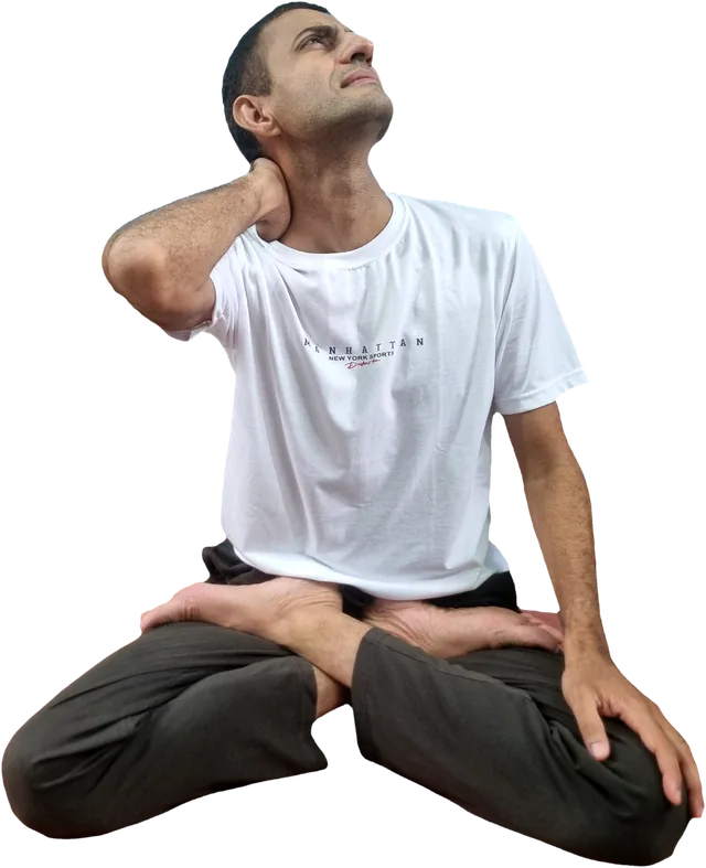 Sohan seated with a hand on the back of his neck, looking up with a pained expression